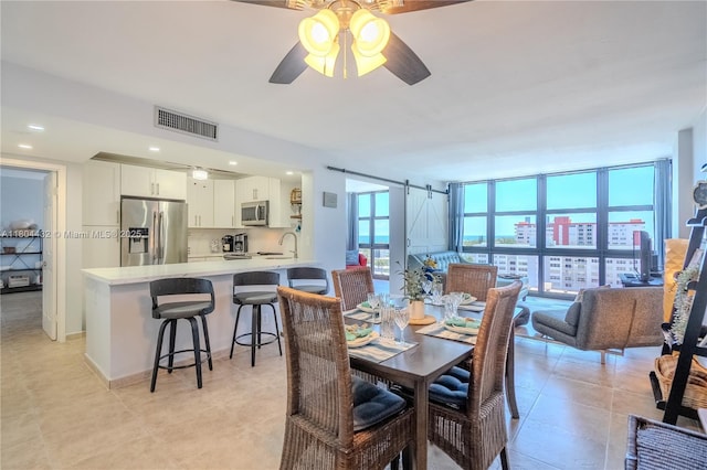 2017 S Ocean Dr Unit 1404, Hallandale Beach, FL 33009 - dining space featuring a ceiling fan and light tile patterned flooring
