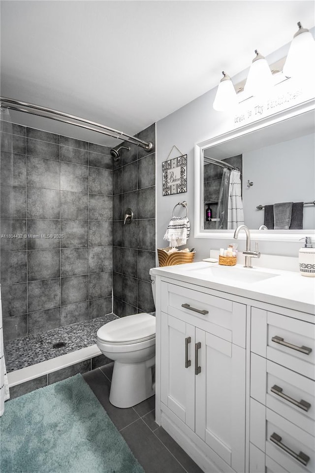 2017 S Ocean Dr Unit 1404, Hallandale Beach, FL 33009 - bathroom featuring vanity, tiled shower, toilet, and tile patterned floors