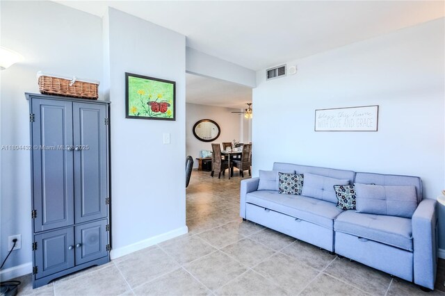 2017 S Ocean Dr Unit 1404, Hallandale Beach, FL 33009 - living room with light tile patterned floors, ceiling fan, and baseboards