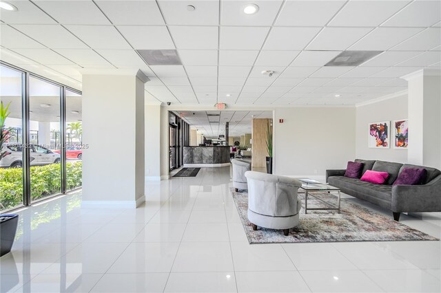 2017 S Ocean Dr Unit 1404, Hallandale Beach, FL 33009 - living room featuring baseboards, tile patterned flooring, recessed lighting, and crown molding