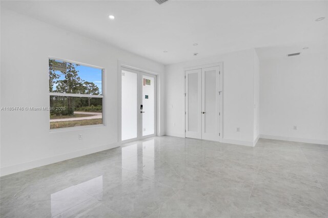 935 Elgin St, Lehigh Acres, FL 33974 - unfurnished room featuring baseboards and recessed lighting