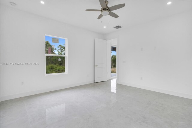 935 Elgin St, Lehigh Acres, FL 33974 - empty room featuring healthy amount of natural light, recessed lighting, a ceiling fan, a smoke detector, and baseboards