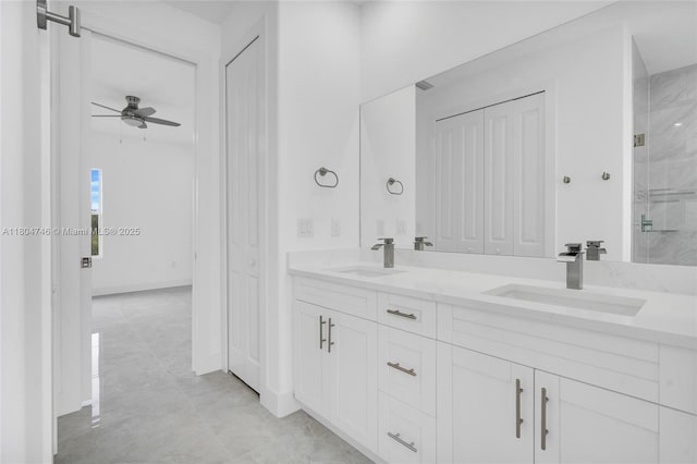 935 Elgin St, Lehigh Acres, FL 33974 - full bathroom featuring a ceiling fan, double vanity, a closet, and a shower with door