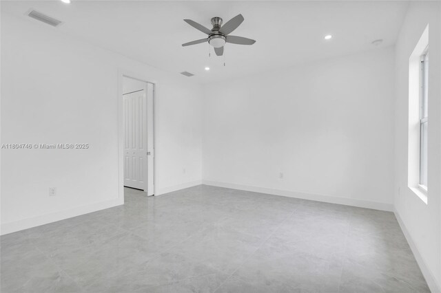 935 Elgin St, Lehigh Acres, FL 33974 - empty room with ceiling fan, recessed lighting, baseboards, and concrete floors