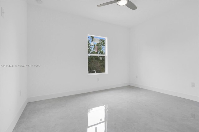 935 Elgin St, Lehigh Acres, FL 33974 - empty room featuring a ceiling fan and baseboards