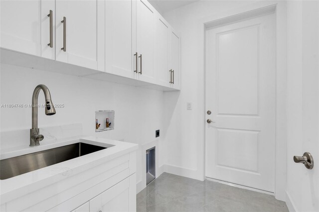 935 Elgin St, Lehigh Acres, FL 33974 - washroom featuring electric dryer hookup, cabinet space, washer hookup, and baseboards