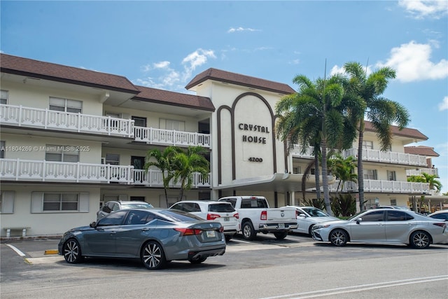 4200 Crystal Lake Dr Unit 204, Deerfield Beach, FL 33064 - view of building exterior with uncovered parking