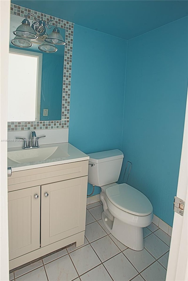 4200 Crystal Lake Dr Unit 204, Deerfield Beach, FL 33064 - half bathroom featuring toilet, vanity, and tile patterned floors