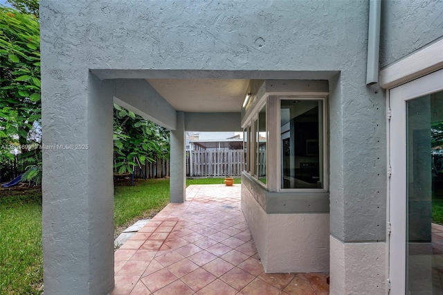 view of patio featuring fence