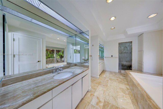 6400 Caballero Blvd, Coral Gables, FL 33146 - bathroom with vanity, a garden tub, a stall shower, a tray ceiling, and recessed lighting