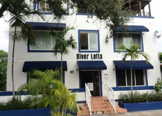 1021 NW 3rd St Unit 106, Miami, FL 33128 - view of front of property with stucco siding