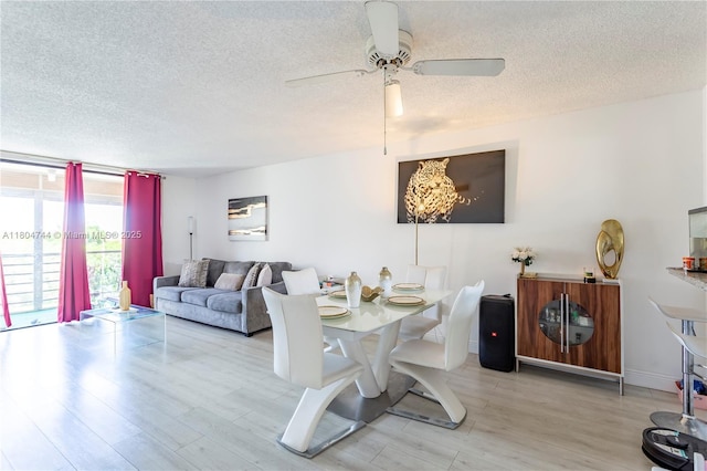 1830 SW 81st Ave Unit 4418, North Lauderdale, FL 33068 - dining area featuring a textured ceiling, wood finished floors, and a ceiling fan