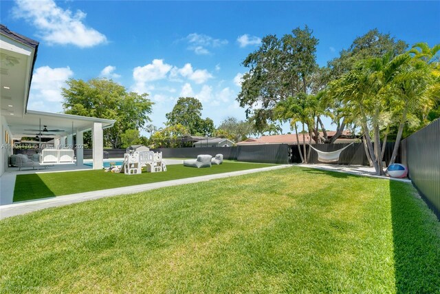 7843 SW 166th St, Palmetto Bay, FL 33157 - view of yard featuring a ceiling fan and a patio area