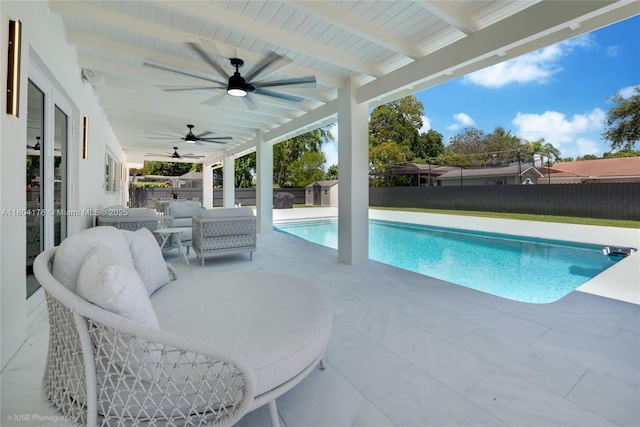 7843 SW 166th St, Palmetto Bay, FL 33157 - view of swimming pool featuring a ceiling fan, a shed, a fenced backyard, and a patio