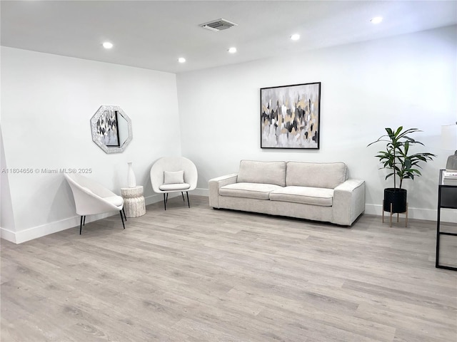 2421 N 56th Ter, Hollywood, FL 33021 - living area featuring baseboards, wood finished floors, and recessed lighting