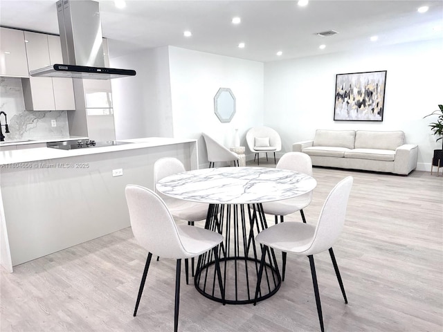 2421 N 56th Ter, Hollywood, FL 33021 - dining area with light wood-style flooring and recessed lighting