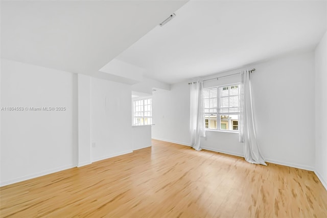 1051 Meridian Ave Unit 1D, Miami Beach, FL 33139 - spare room with wood finished floors and baseboards
