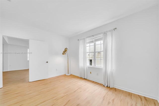 1051 Meridian Ave Unit 1D, Miami Beach, FL 33139 - unfurnished room with wood finished floors and baseboards