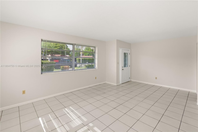 1242 Sevilla Ave, Coral Gables, FL 33134 - empty room with baseboards and light tile patterned flooring
