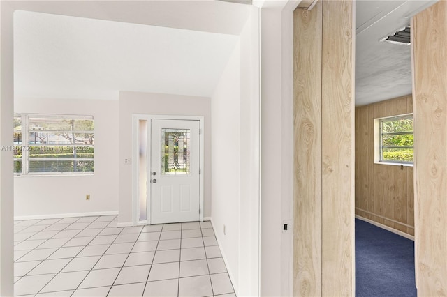1242 Sevilla Ave, Coral Gables, FL 33134 - entrance foyer with baseboards, wooden walls, and tile patterned floors