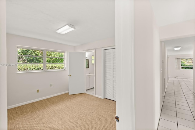 1242 Sevilla Ave, Coral Gables, FL 33134 - empty room with baseboards and light carpet