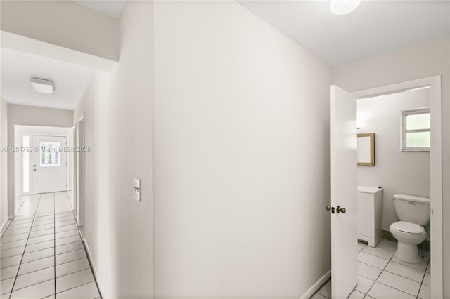 1242 Sevilla Ave, Coral Gables, FL 33134 - hall with light tile patterned floors and baseboards