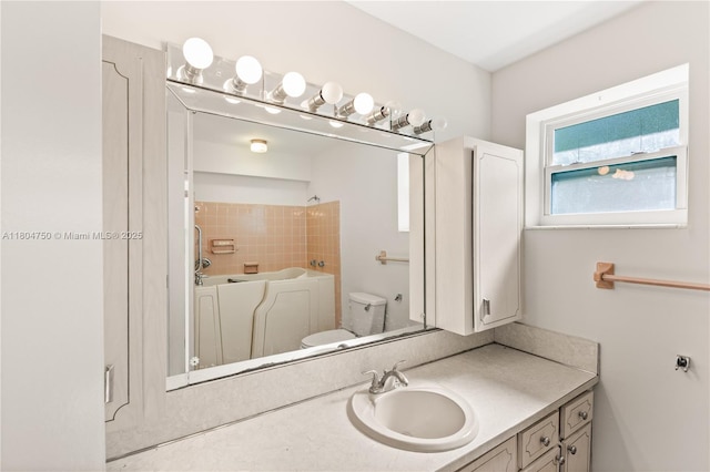 1242 Sevilla Ave, Coral Gables, FL 33134 - bathroom featuring vanity, a tub to relax in, and toilet