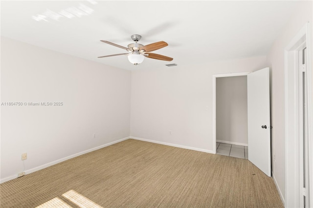 1242 Sevilla Ave, Coral Gables, FL 33134 - unfurnished bedroom with light carpet, a ceiling fan, and baseboards