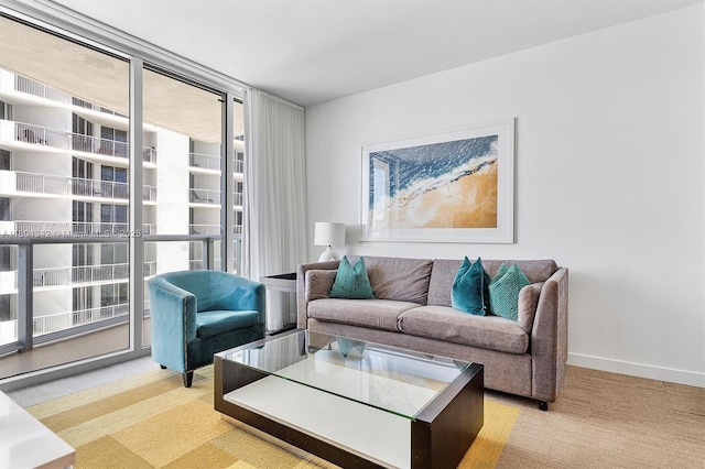17315 Collins Ave Unit 1008, Sunny Isles Beach, FL 33160 - living area with a wall of windows, carpet flooring, plenty of natural light, and baseboards
