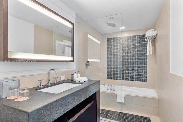 17315 Collins Ave Unit 1008, Sunny Isles Beach, FL 33160 - full bathroom with decorative backsplash, vanity, and tile walls