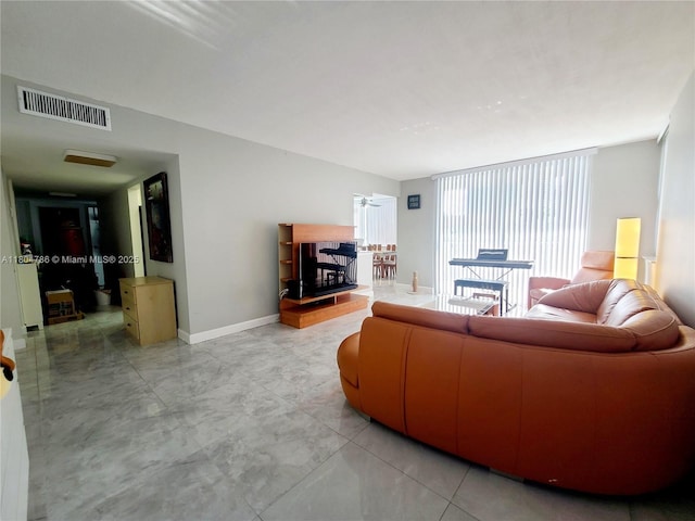 16565 NE 26th Ave Unit 2B, North Miami Beach, FL 33160 - living area featuring baseboards