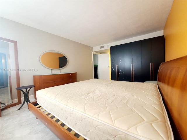 16565 NE 26th Ave Unit 2B, North Miami Beach, FL 33160 - bedroom with a closet and baseboards