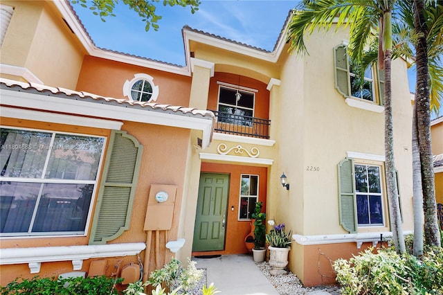2250 NE 42nd Cir, Homestead, FL 33033 - doorway to property featuring a balcony and stucco siding