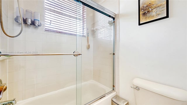 2250 NE 42nd Cir, Homestead, FL 33033 - bathroom featuring toilet and combined bath / shower with glass door