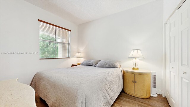 2250 NE 42nd Cir, Homestead, FL 33033 - bedroom with a closet, wood finished floors, and baseboards