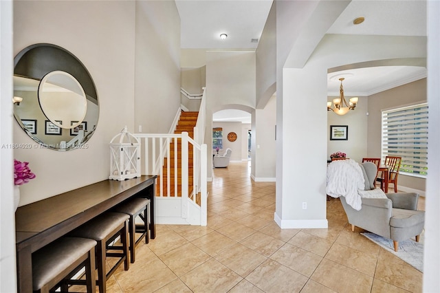 4470 E Seneca Ave, Weston, FL 33332 - corridor featuring arched walkways, light tile patterned flooring, a chandelier, stairs, and ornamental molding