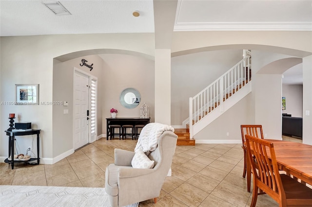 4470 E Seneca Ave, Weston, FL 33332 - dining room with stairs, arched walkways, light tile patterned floors, and crown molding