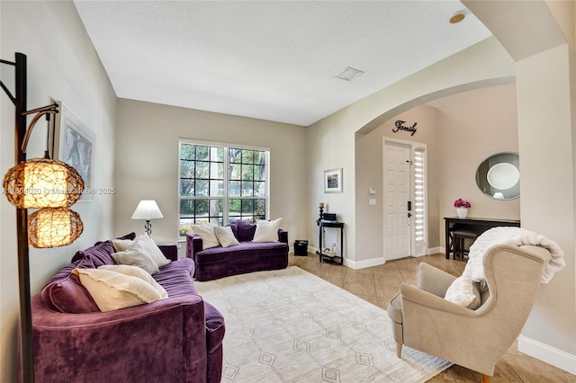 4470 E Seneca Ave, Weston, FL 33332 - living area with arched walkways and light tile patterned floors