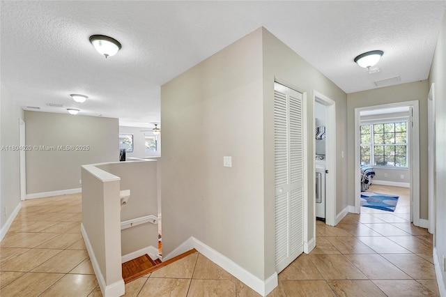 4470 E Seneca Ave, Weston, FL 33332 - hallway with an upstairs landing, a textured ceiling, and light tile patterned flooring