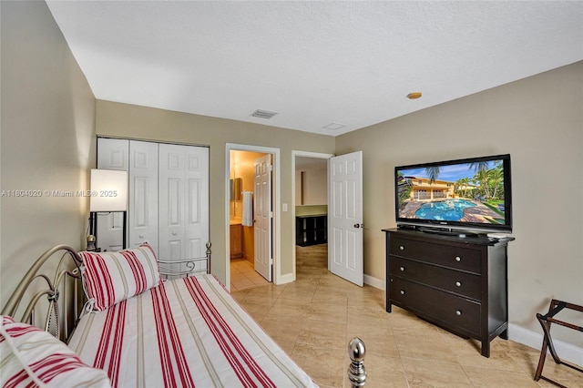 4470 E Seneca Ave, Weston, FL 33332 - bedroom featuring light tile patterned floors, ensuite bathroom, and a closet