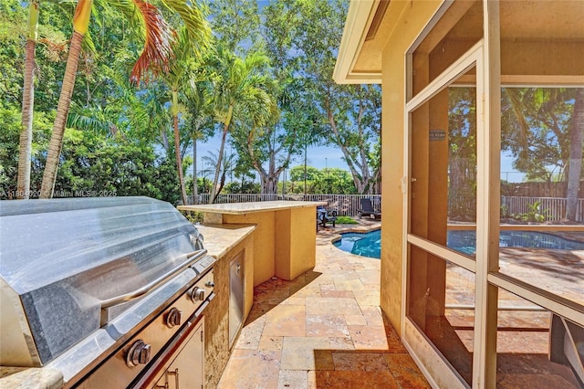 4470 E Seneca Ave, Weston, FL 33332 - fenced backyard with exterior kitchen, a patio area, and an outdoor bar