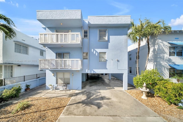 1530 Pennsylvania Ave Unit 203, Miami Beach, FL 33139 - view of front of property featuring a carport and stucco siding