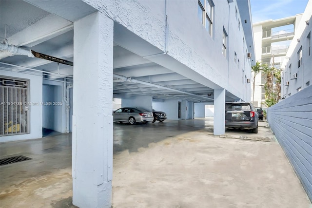 1530 Pennsylvania Ave Unit 203, Miami Beach, FL 33139 - view of parking / parking lot with a parking deck