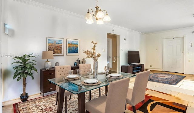 232 SE 6th St, Dania Beach, FL 33004 - dining room with crown molding, a chandelier, and baseboards