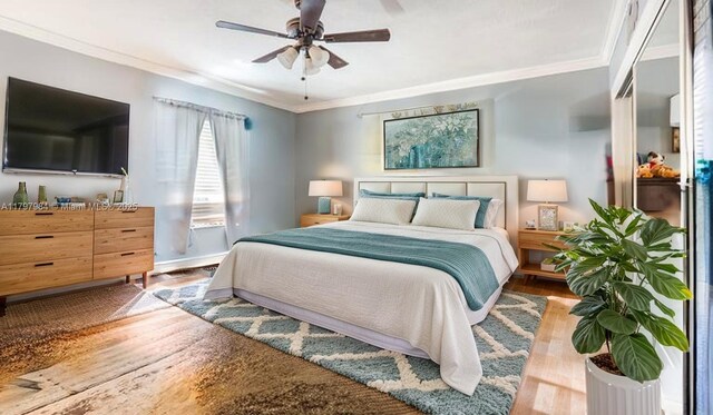 232 SE 6th St, Dania Beach, FL 33004 - bedroom with crown molding, wood finished floors, a ceiling fan, and baseboards