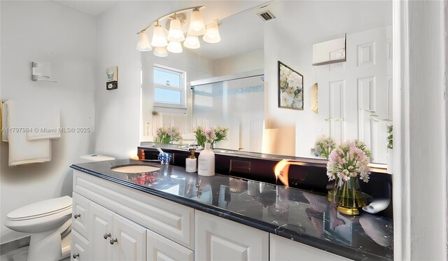 232 SE 6th St, Dania Beach, FL 33004 - bathroom featuring vanity, a stall shower, and toilet