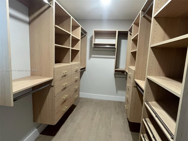 13000 SW 69th Ct, Pinecrest, FL 33156 - spacious closet with wood finished floors and built in study area