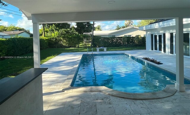 13000 SW 69th Ct, Pinecrest, FL 33156 - view of swimming pool with french doors and a patio
