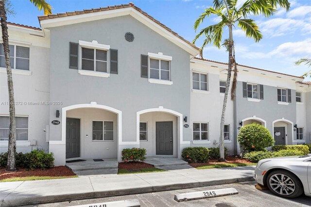 2946 SE 15th Ter, Homestead, FL 33035 - townhome / multi-family property featuring uncovered parking and stucco siding