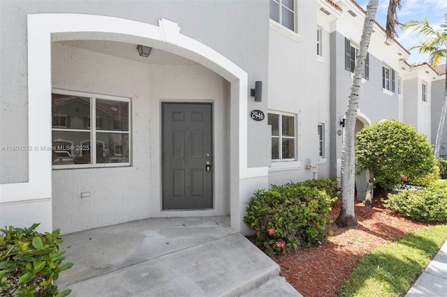 2946 SE 15th Ter, Homestead, FL 33035 - doorway to property with stucco siding